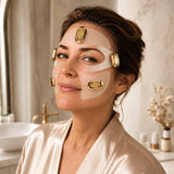 Woman in a silk robe wearing the EMSTIGHT EMS Eye, Cheek and Forehead Patches across the upper face
